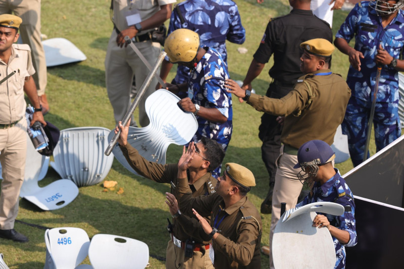 Kolkata Police trying to proctect themselves from a riot caused by miss management by the organisation during Lionel Messi G.O.A.T tour 2025 in Kolkata City Of Joy at Vivekananda Yuba Bharati Krirangan(VYBK) Stadium, Kolkata, West Bengal, India 13th Decem