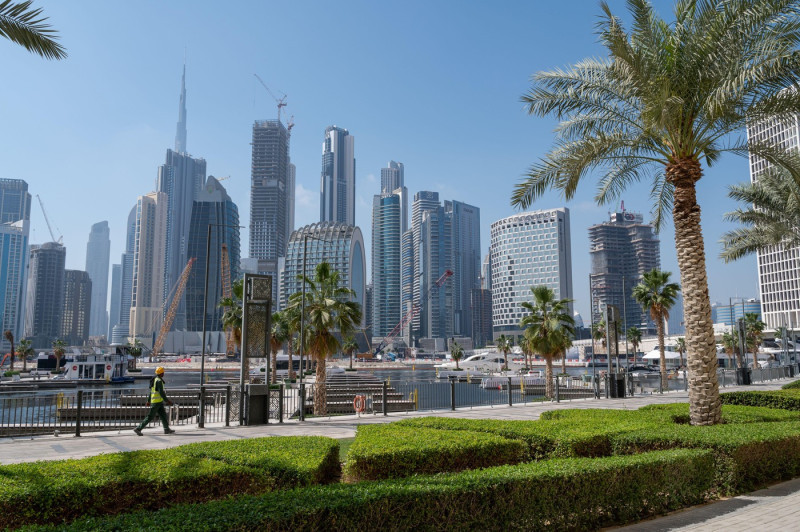 18.03.2025, Dubai, United Arab Emirates, Asia - Waterfront promenade and marina along Al Jadaf Dubai Canal with the modern city skyline in backdrop.