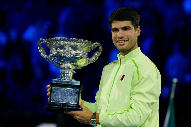 Melbourne, Australia. 1st Feb, 2026. 1st seed CARLOS ALCARAZ of Spain with the The Norman Brookes Challenge Cup after defeating 4th seed NOVAK DJOKOVIC of Serbia on Rod Laver Arena in the Men's Singles Final match on day 15 of the 2026 Australian Open in