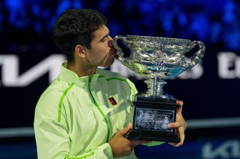 Melbourne, Australia. 1st Feb, 2026. 1st seed CARLOS ALCARAZ of Spain with the The Norman Brookes Challenge Cup after defeating 4th seed NOVAK DJOKOVIC of Serbia on Rod Laver Arena in the Men's Singles Final match on day 15 of the 2026 Australian Open in