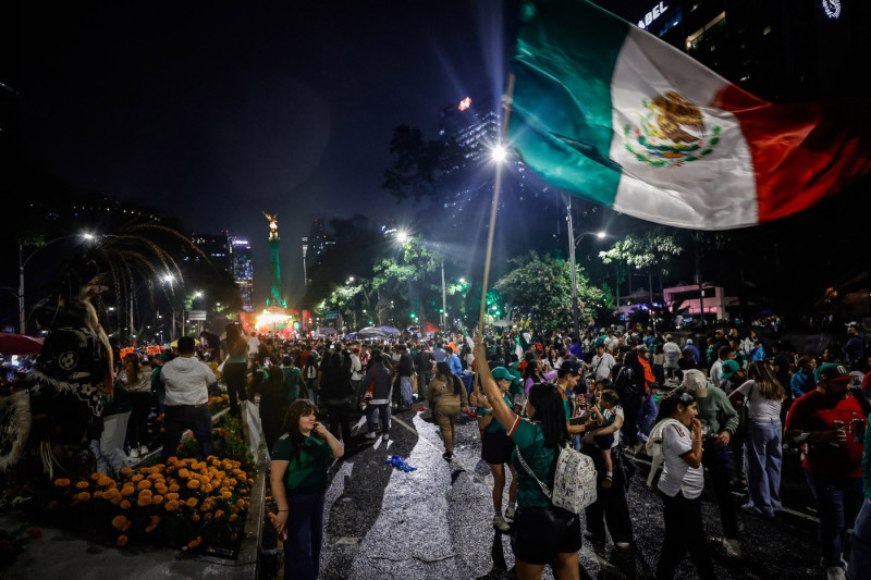 Mexican fans celebrate Mexico's victory against South Africa after the World Cup opener