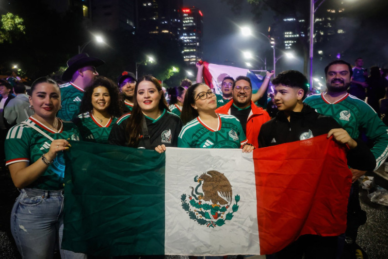 Mexican fans celebrate Mexico's victory against South Africa after the World Cup opener