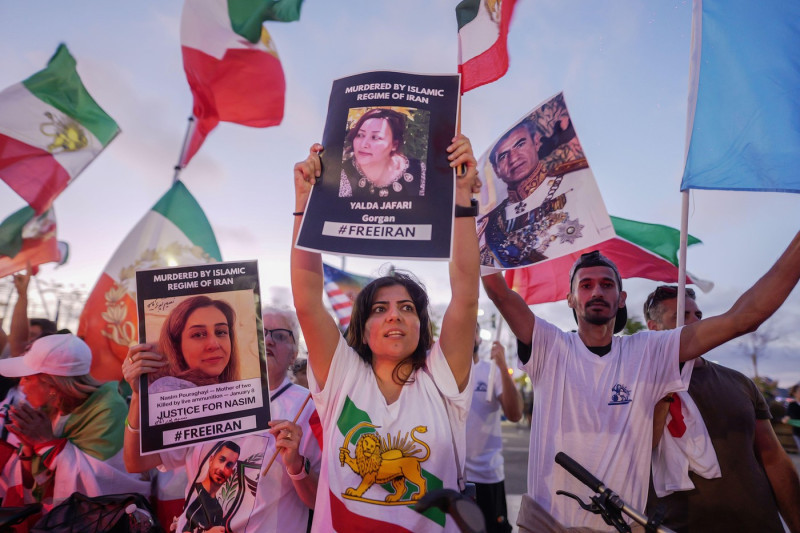Demonstrators plan to wear T-shirts featuring the Lion and Sun emblem and wave the flag used prior to the 1979 Islamic Revolution, protesting the deadly crackdown on dissent in Tehran. Iranian-Americans are divided over Iran's participation in the World C