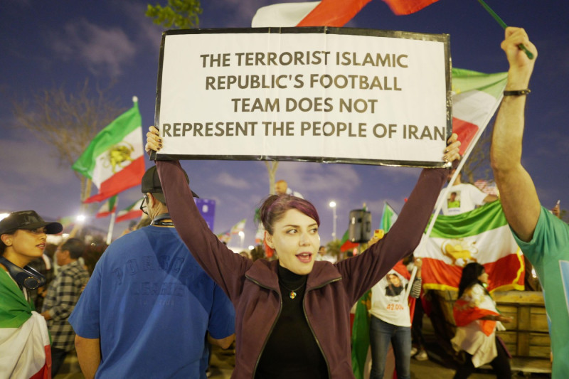 Demonstrators plan to wear T-shirts featuring the Lion and Sun emblem and wave the flag used prior to the 1979 Islamic Revolution, protesting the deadly crackdown on dissent in Tehran. Iranian-Americans are divided over Iran's participation in the World C