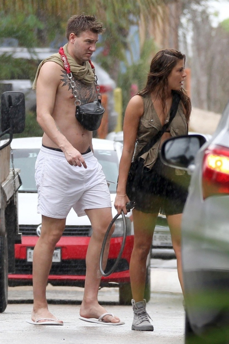 *EXCLUSIVE* Nicklas Bendtner and Philine Ip out for a stroll in the rain in Tulum
