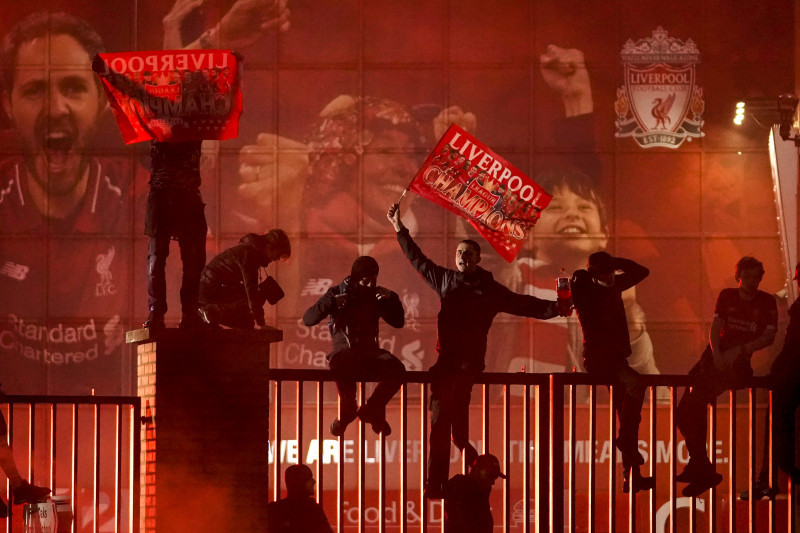 Fans Celebrate As Liverpool FC Lift The Premiership Trophy At Anfield