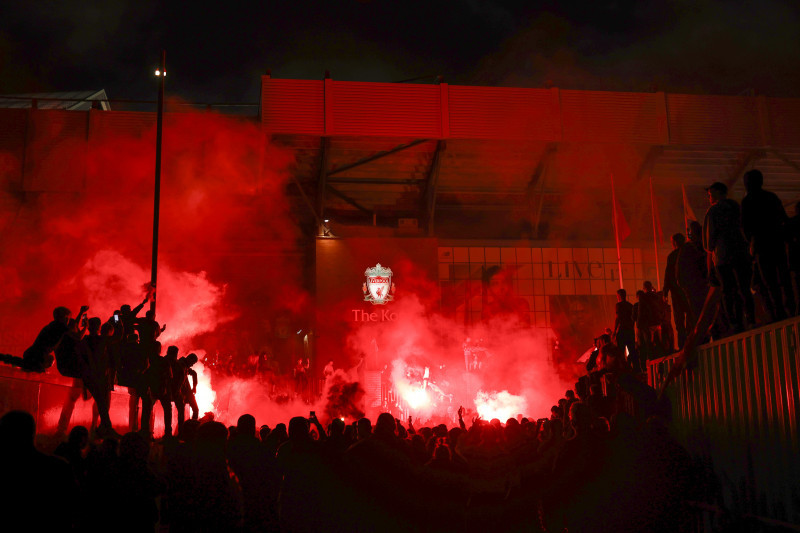 Fans Celebrate As Liverpool FC Lift The Premiership Trophy At Anfield