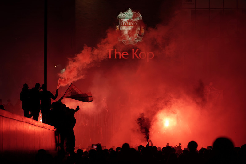 Fans Celebrate As Liverpool FC Lift The Premiership Trophy At Anfield