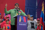 17 May 2018, Venezuela, Caracas: Former Argentinian soccer star Diego Maradona (R) holds the Venezuelan flag while Venezuelan President Nicolas Maduro gives his final campaign speech. On 20 May, Maduro aims to be confirmed in office until 2025. Photo: Ray