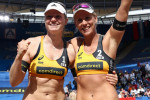 03 July 2019, Hamburg: Beach Volleyball, World Championship, at Rothenbaum Stadium: Round of 32, Women. Borger/Sude (Germany) - Behrens/Tillmann (Germany). Karla Borger and Julia Sude (l) are happy about their victory on the Center Court. Photo: Christian