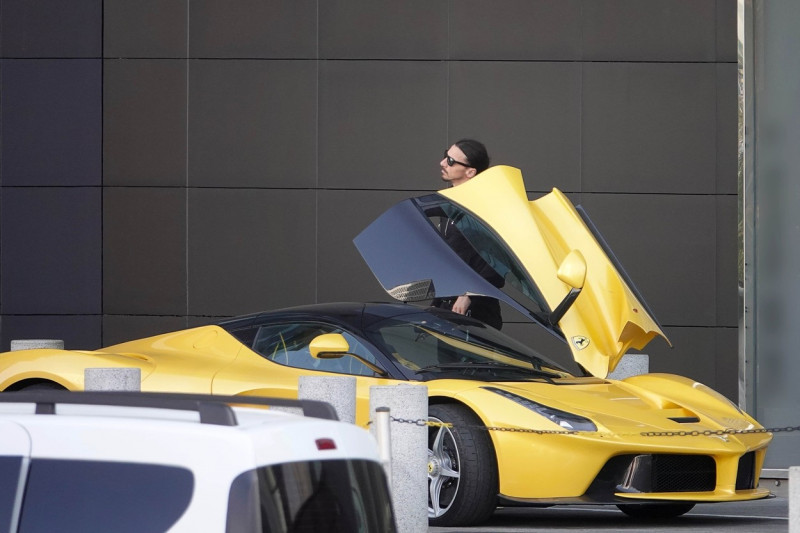 Milan AC soccer player Zlatan Ibrahimovic drives his limited production hybrid sport car Ferrari