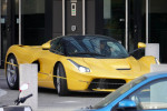 Milan AC soccer player Zlatan Ibrahimovic drives his limited production hybrid sport car Ferrari