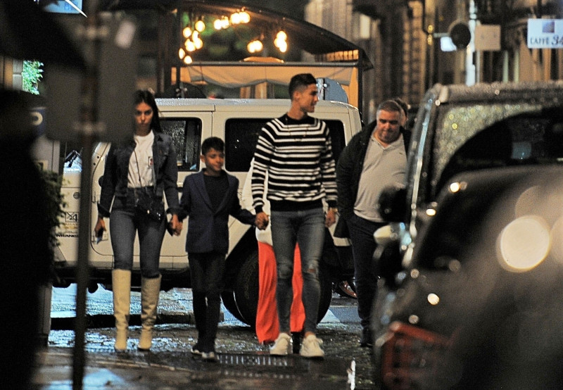 *EXCLUSIVE* Cristiano Ronaldo and his family surrounded by his security entourage leaving a restaurant in Turin