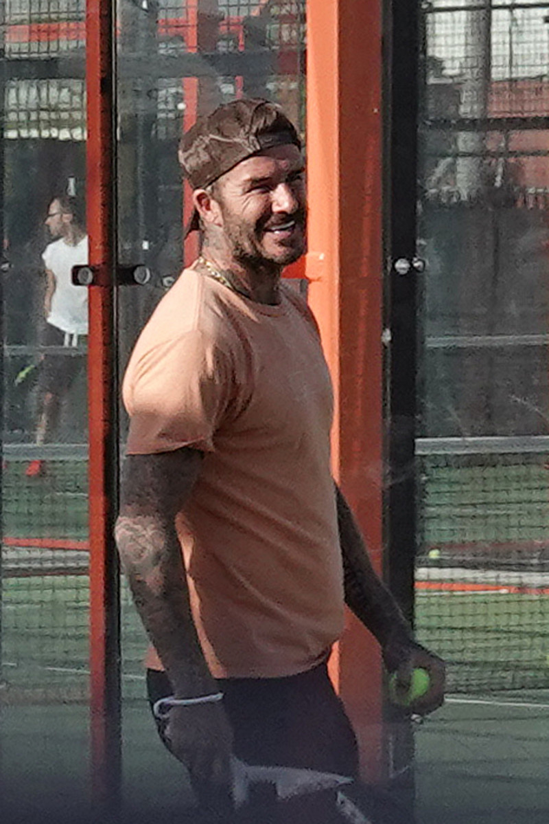 EXCLUSIVE: David Beckham looks intensely focused as he tries out a new sport, paddle ball, with friends in Miami