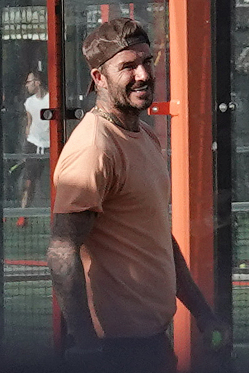 EXCLUSIVE: David Beckham looks intensely focused as he tries out a new sport, paddle ball, with friends in Miami