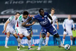 OHL's Pierre Yves Ngawa and Mouscron's Harlem Gnohere fight for the ball during a soccer match between Oud-Heverlee Leuven and Royal Excel Mouscron, T