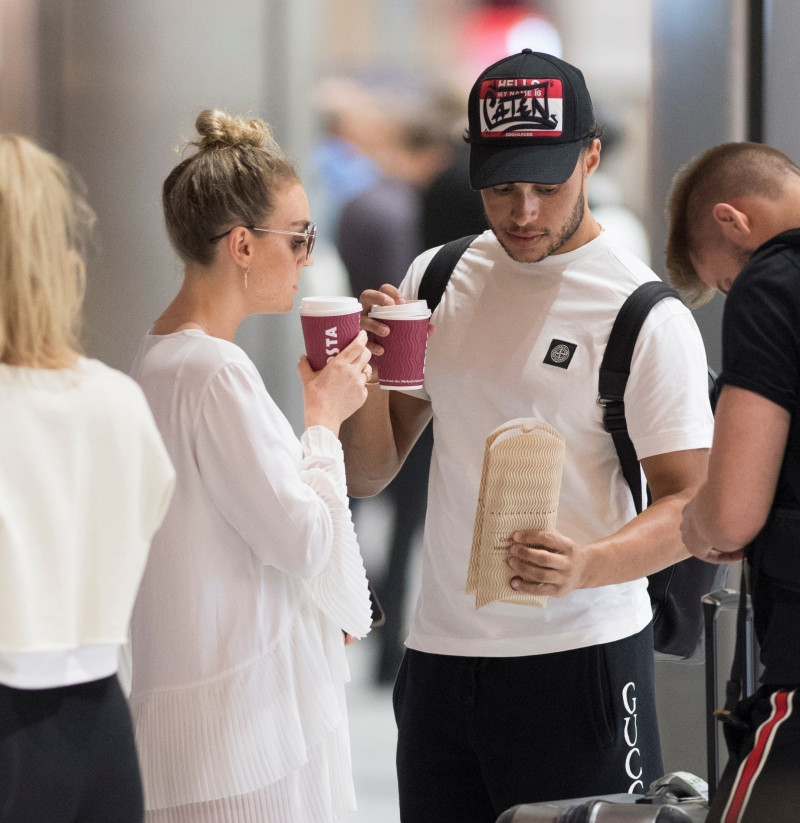 *EXCLUSIVE* Perrie Edwards and injured Alex Oxlade Chamberlain return from Mykonos holiday