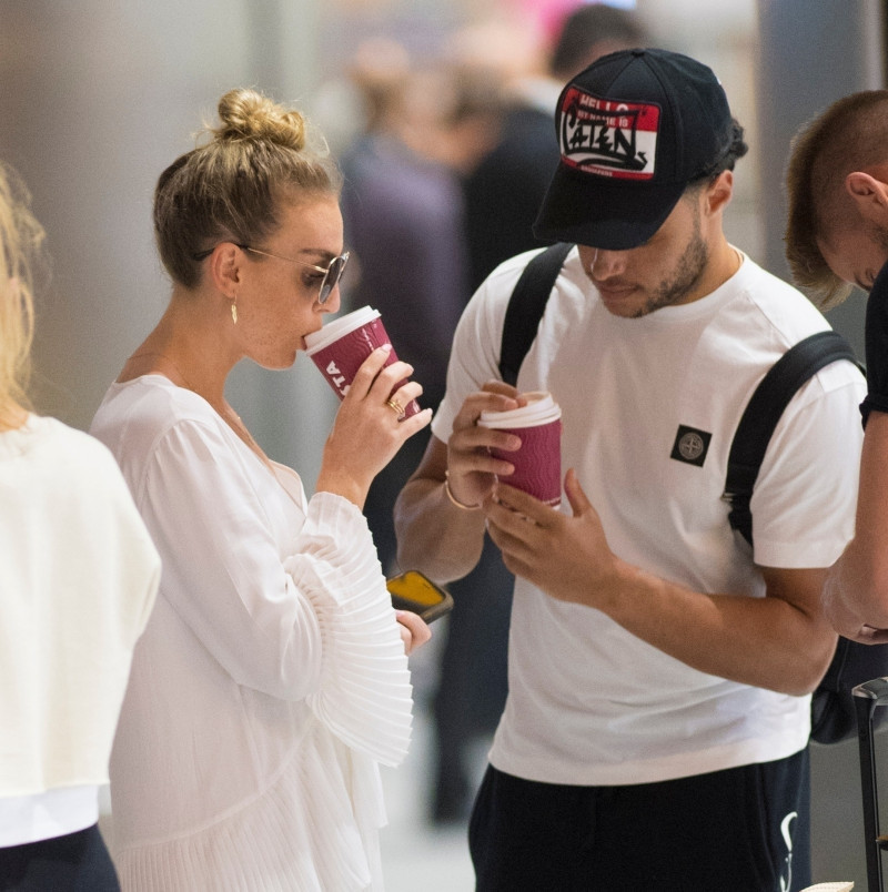 *EXCLUSIVE* Perrie Edwards and injured Alex Oxlade Chamberlain return from Mykonos holiday