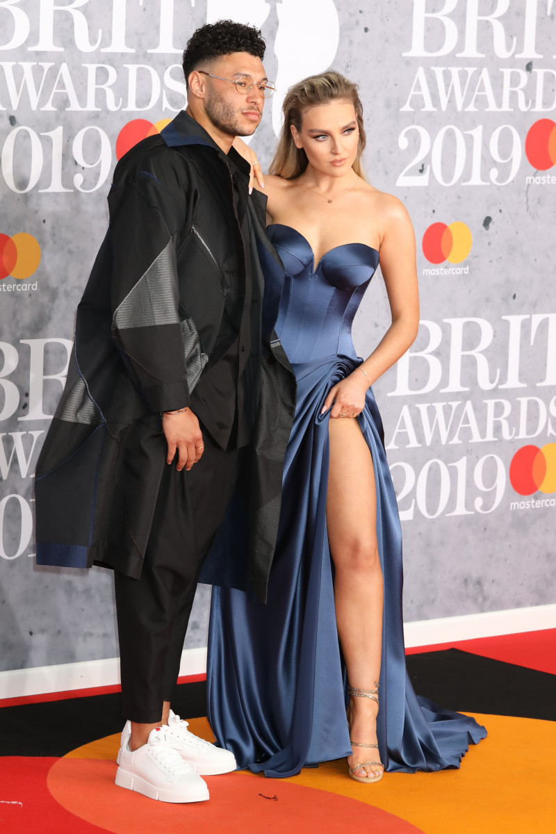 Perrie Edwards and Alex Oxlade-Chamberlain are seen arriving at the O2 in London for the 2019 Brit Awards.