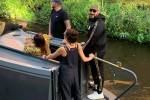 Gypsy King Tyson Fury passes through Manchesters Gay Village on a canal boat.