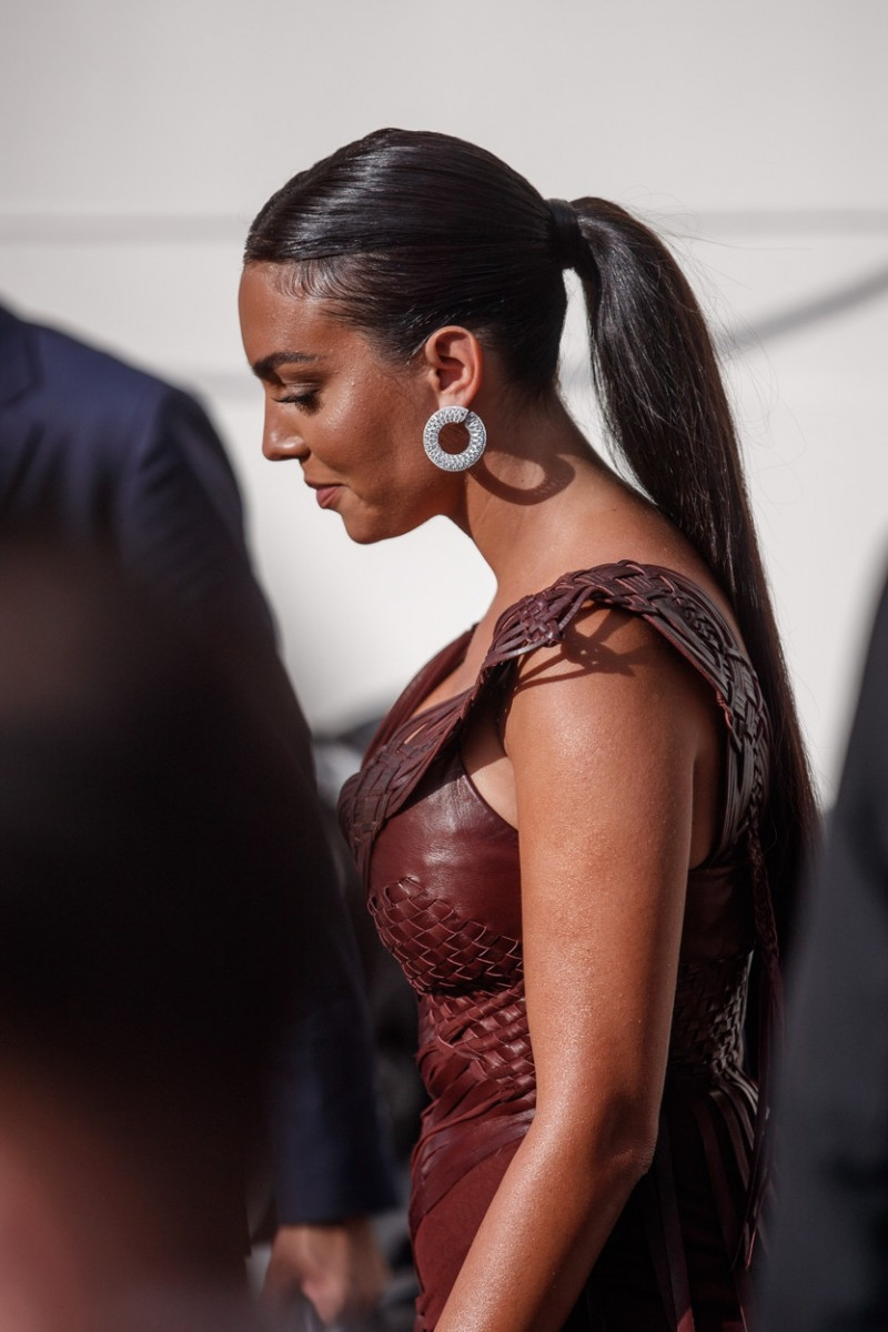 Georgina Rodriguez spotted at the Martinez Hotel in a long burgundy dress during the 74th Cannes Film Festival.