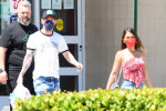 EXCLUSIVE: Argentine football star Lionel Messi and wife Antonella head to a Walgreens pharmacy, presumably to ged a Covid-19 vaccine, and he and his family members later emerged with their red band-aids proudly displayed