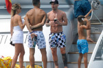 Soccer player Lionel Messi and Luis Suarez enjoy a boat day with their family