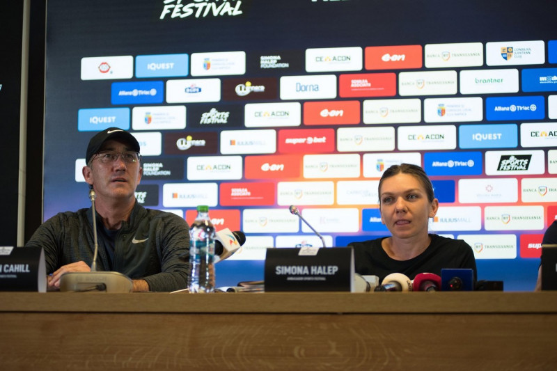 CLUJ, ROMANIA - JUNE 14, 2019: Tennis coach Darren Cahill and player Simona Halep answering questions during a press conference at Sports Festival