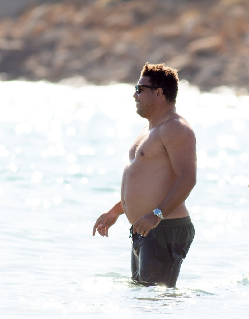 EXCLUSIVE: Shirtless Ronaldo Nazario enjoys a swim in the waters of Ibiza