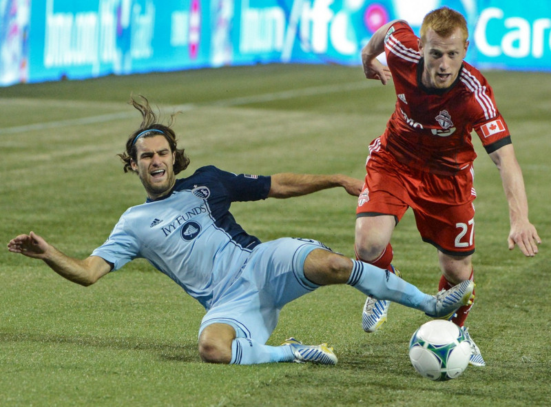 Graham Zusi and Richard Eckersley during game in 2013