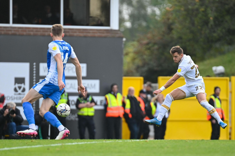 Vale Park, Burslem, UK, 16th Oct 2021. Pictured is Port Vale's number 22 and substitute Dennis Politic shooting and scoring Valer's equaliser during Vale's 3-1 win against Barrow in the EFL League Two fixture. Credit: TeeGeePix/Alamy Live News