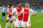 DORTMUND, NETHERLANDS - NOVEMBER 3: Dusan Tadic of Ajax is celebrating his goal, with Noussair Mazraoui of Ajax during the UEFA Champions League Group stage match between Borussia Dortmund and Ajax at Signal Iduna Park on November 3, 2021 in Dortmund, Ne