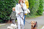 *EXCLUSIVE* Spice Girl Geri Halliwell AKA Ginger Spice pictured rocking an all-white outfit as she's pictured out walking her beloved pet dogs with a friend in North London.