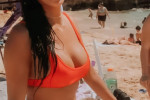 Wearing her fiery hot bikini, the Pussycat Doll's Nicole Scherzinger hits the beach as boyfriend Thom Evans showed off a few dance moves on holiday in Hawaii.