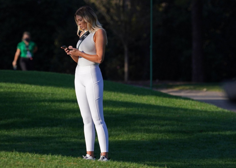 Augusta, United States. 14th Nov, 2020. Paulina Gretzky, partner of pro golfer Dustin Johnson, checks her cell phone during the third round of the 2020 Masters golf tournament at Augusta National Golf Club in Augusta, Georgia on Saturday, November 14, 202