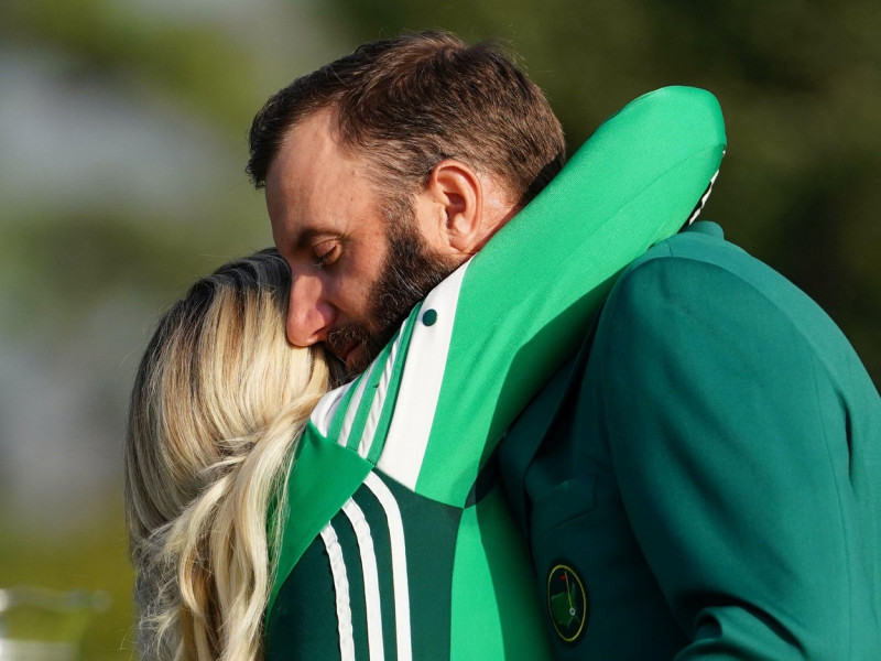 Augusta, United States. 15th Nov, 2020. 2020 champion Dustin Johnson wears the Green Jacket for the first time while he and Paulina Gretzky embrace after the final round of the 2020 Masters golf tournament at Augusta National Golf Club in Augusta, Georgia