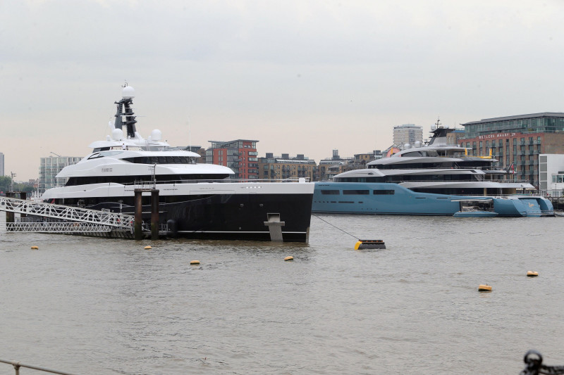 London, UK. 5th July, 2018. In an extraordinary show of billionaire wealth Tottenham Football Club owners Joe Lewis's Super yacht Aviv (light blue) has been joined on the Thames by Tower Bridge by the brand new $100m Elandess (dark blue) reportedly owned