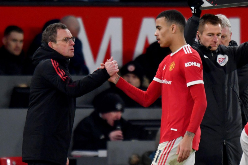 Manchester, UK. 22nd Jan, 2022. Manchester United Caretaker Manager Ralf Rangnick substitutes Manchester United's Mason Greenwood during the Premier League match at Old Trafford, Manchester, UK. Picture date: Sunday January 23, 2022. Photo credit should r