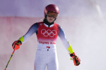Mikaela Shiffrin of the U.S. emerges from a cloud of snow after crashing out of the course