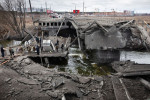 People cross destroyed bridge in Irpin, Ukraine - 05 Mar 2022