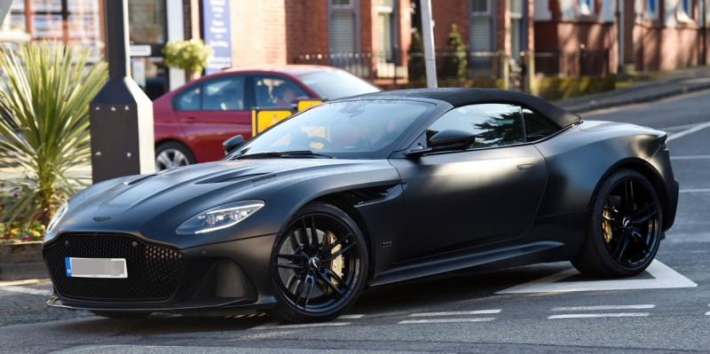 *EXCLUSIVE* Manchester United Hat trick hero Cristiano Ronaldo channels his inner James Bond as he's pictured driving his matt black Aston Martin DBS Superleggera on route to training.