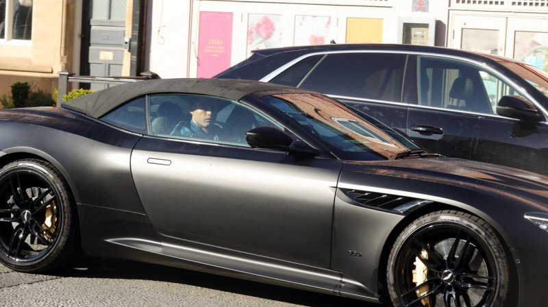 *EXCLUSIVE* Manchester United Hat trick hero Cristiano Ronaldo channels his inner James Bond as he's pictured driving his matt black Aston Martin DBS Superleggera on route to training.