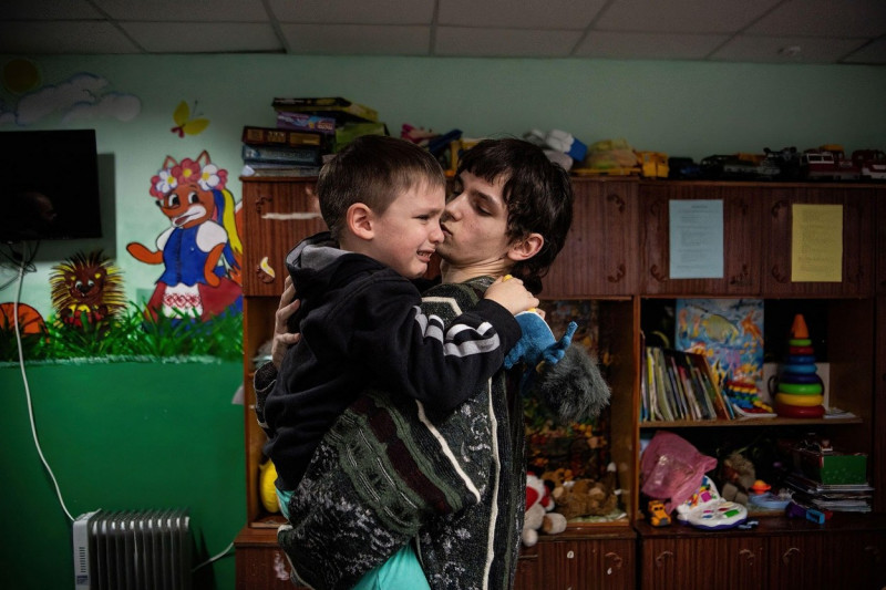 Lviv, Ukraine. 14th Mar, 2022. Sasha (R), 15, comforts his younger brother Timur, 6, at a shelter for children in Lviv. According to the United Nations, more than three million Ukrainians have become refugees and another two million have been internally d