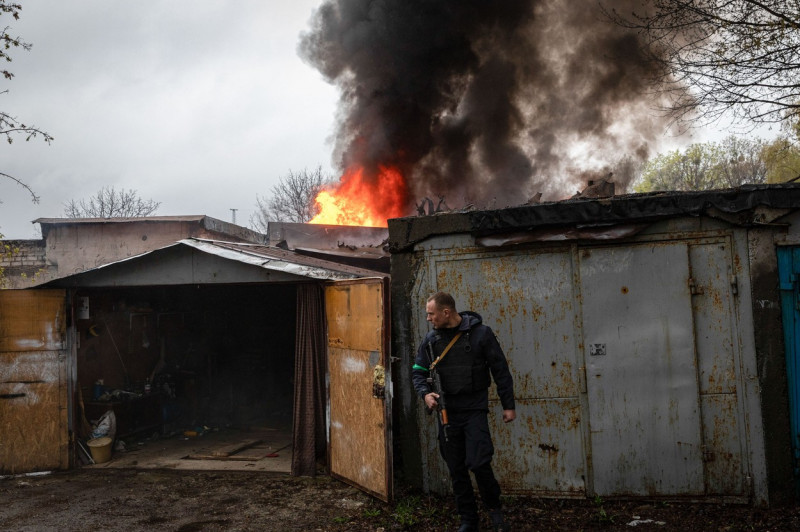 Fire at a garage following a Russian artillery strike in Kharkiv, Ukraine - 18 Apr 2022