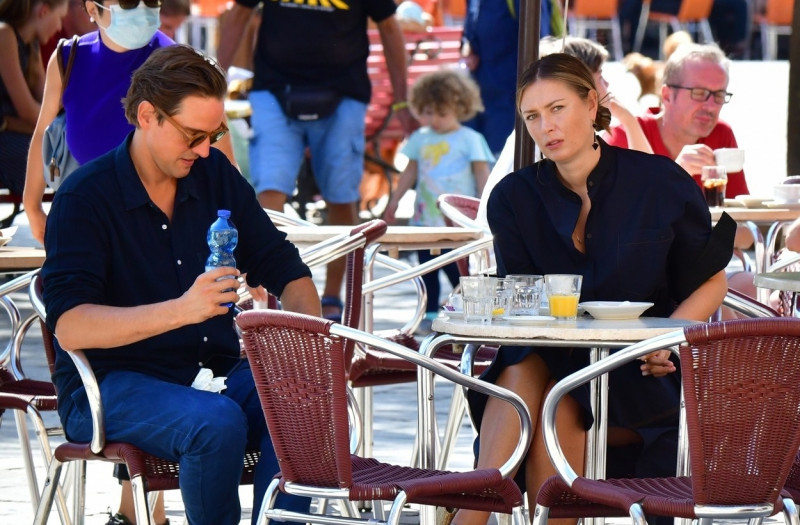 *EXCLUSIVE* Russian tennis player Maria Sharapova and her boyfriend Alexander Gilkes share a crossiant before enjoying some sightseeing in Venice