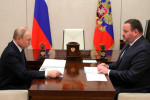 May 4, 2022. - Russia, Moscow Region, Novo-Ogaryovo. - Russian President Vladimir Putin (left) meets with Russian Labour and Social Safety Minister Anton Kotyakov to discuss support for labour market and families with kids and people with disabilities.