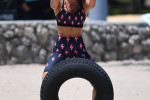 American fitness model Jennifer Nicole Lee warms up before the filming of “Chrisley Knows Best” in Miami Beach