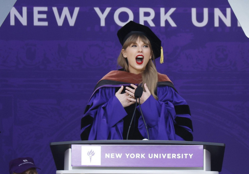 New York, United States. 18th May, 2022. Taylor Swift delivers the commencement speech after she receives an Honorary Doctor of Fine Arts degree for the graduates of New York University's class of 2022 at Yankee Stadium in New York City on Wednesday, May