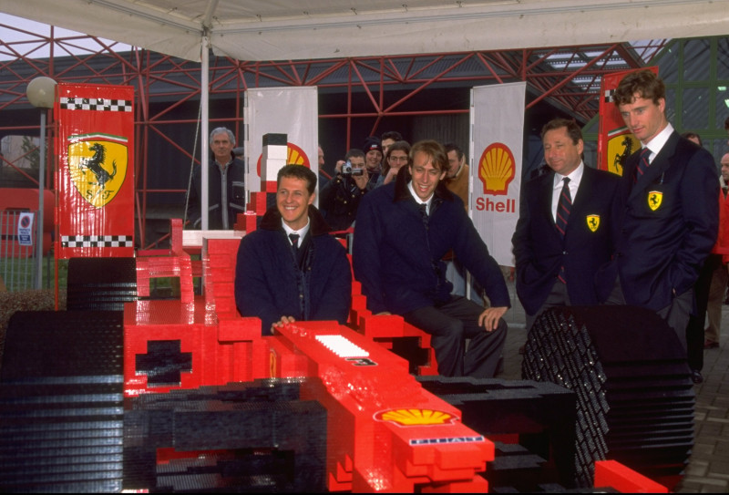 Michael Schumacher of Germany tries out the Lego Ferrari