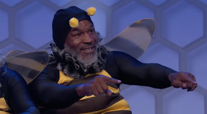 Mike Tyson dresses in wacky bumblebee costume with striped wings and fluffy ears to judge spelling bee on Jimmy Kimmel Live!